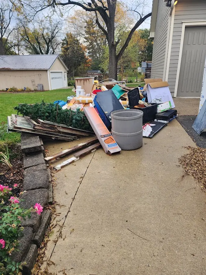 Dumpster being loaded with debris for Demolition Dumpster Rental in Reidland